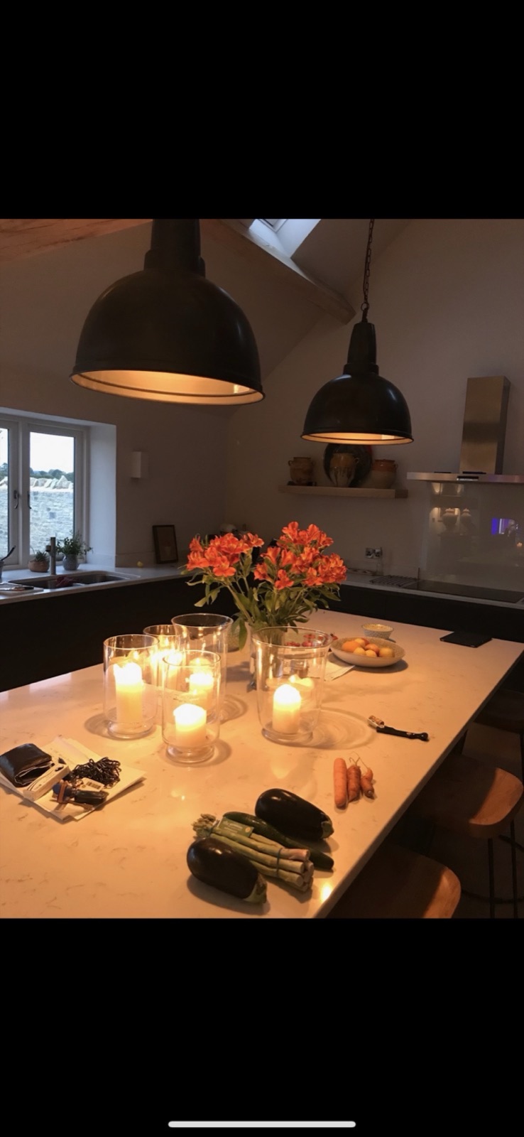 Kitchen with industrial pendants and skylight