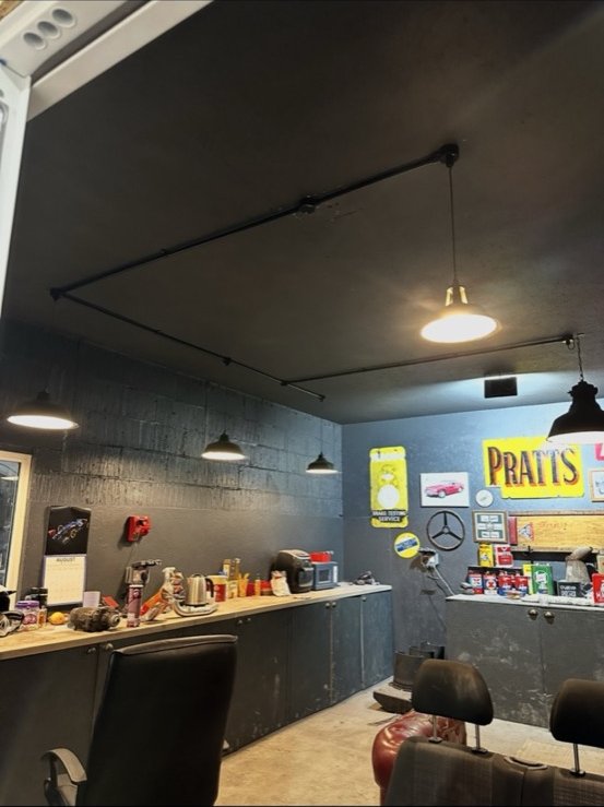 Commercial barber shop with industrial track lighting
