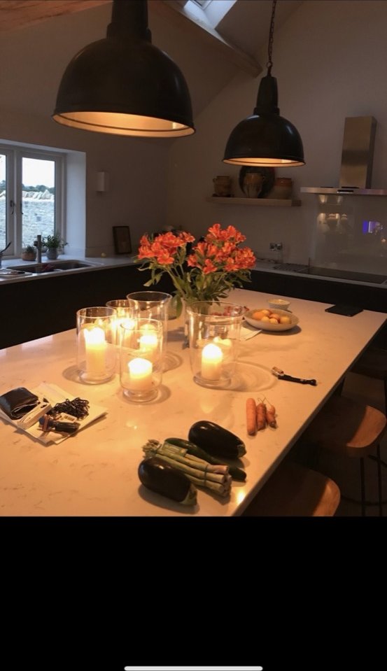 Kitchen with industrial pendants and candlelight ambience