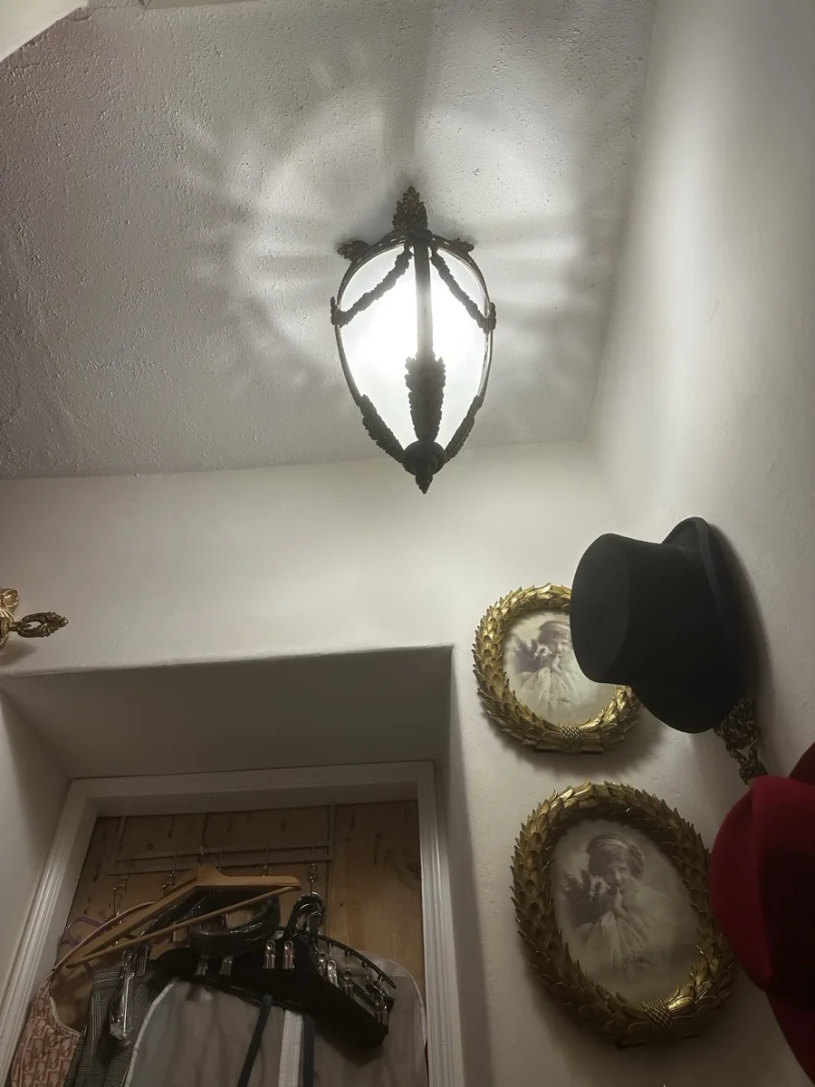 Brass period wall sconce fitted in a heritage property