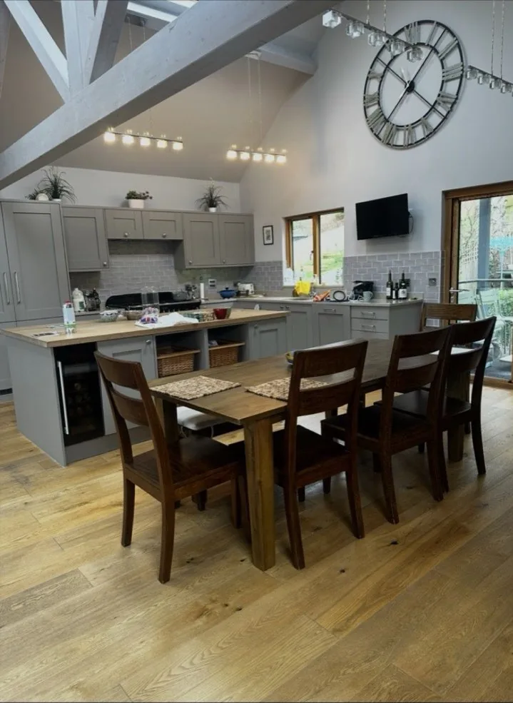Vaulted-ceiling kitchen lighting installation in a period barn conversion